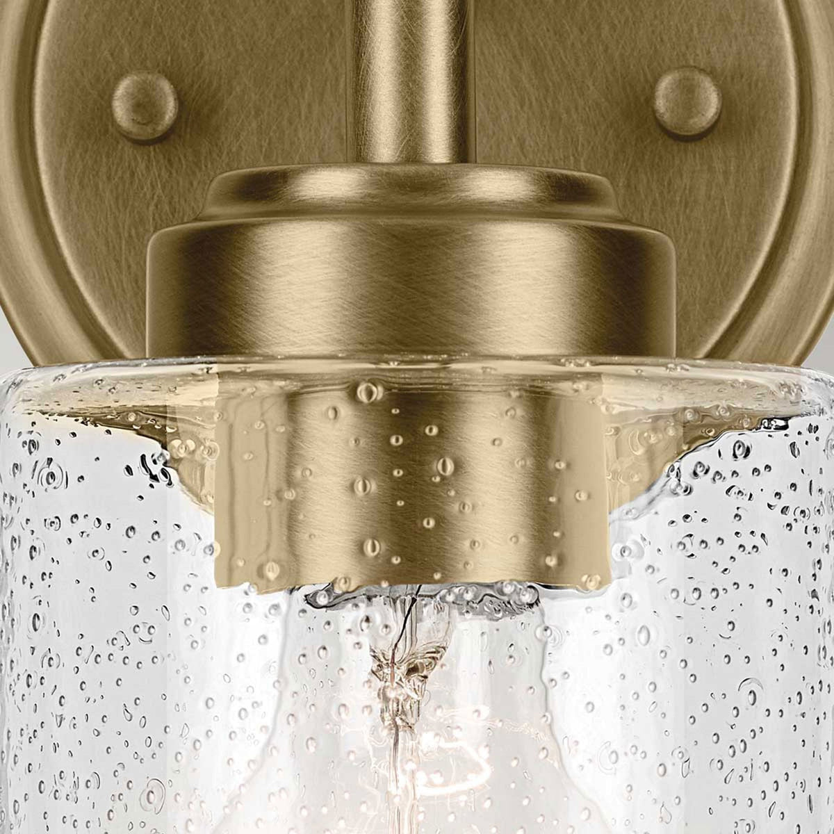 Winslow Single Arm Wall Light in Natural Brass with Clear Seeded Glass