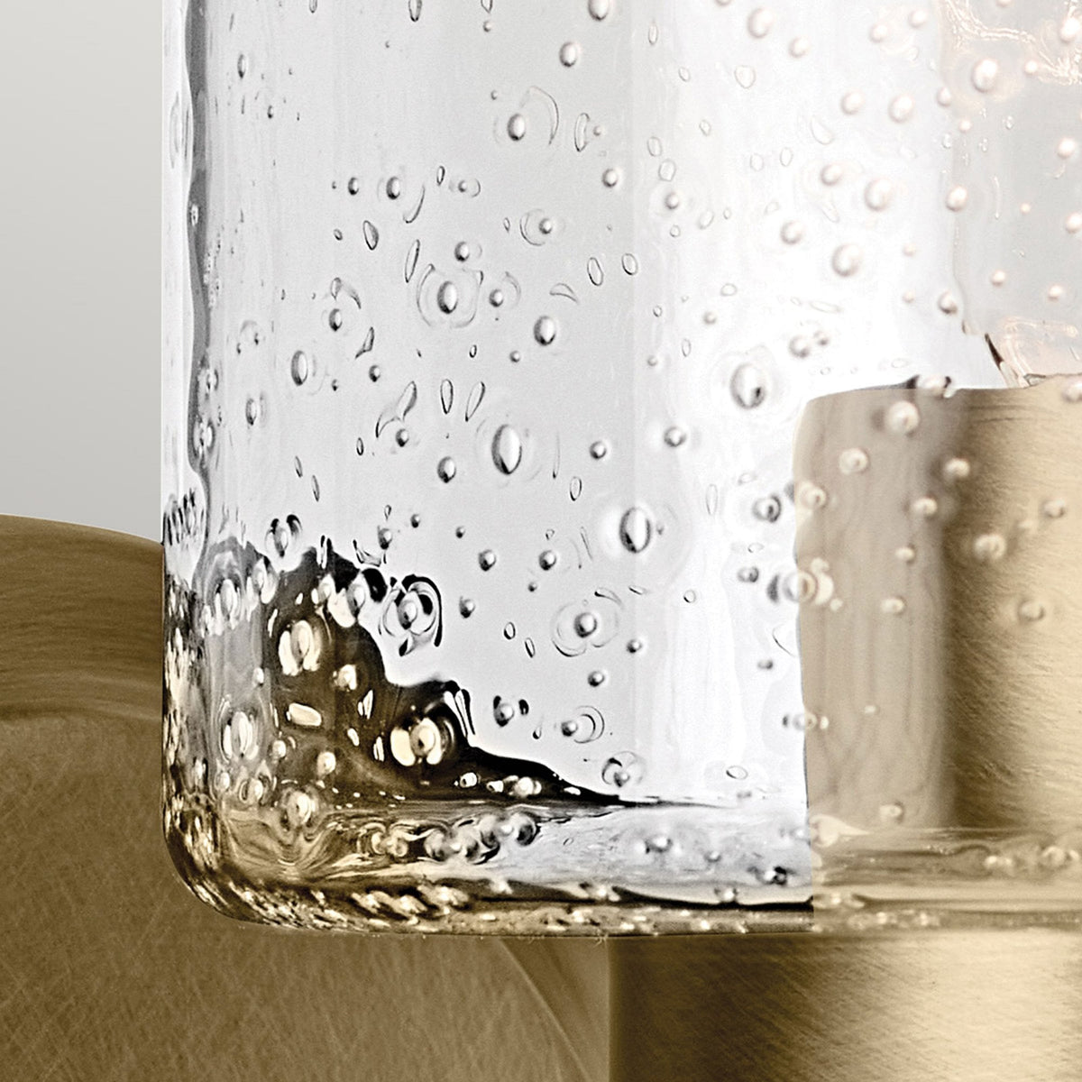 Winslow Single Arm Wall Light in Natural Brass with Clear Seeded Glass