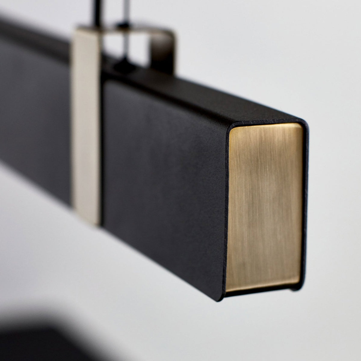 Lilt Linear LED Pendant in Black with Brass Detail