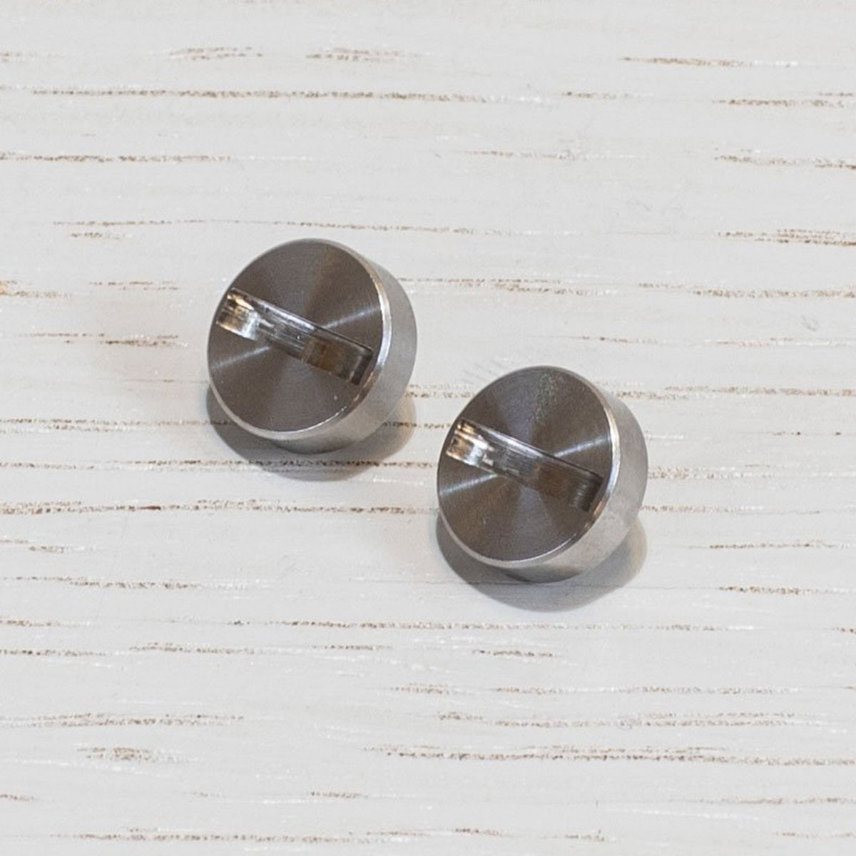 A Pair of Replacement Coin Caps For Switches in Steel