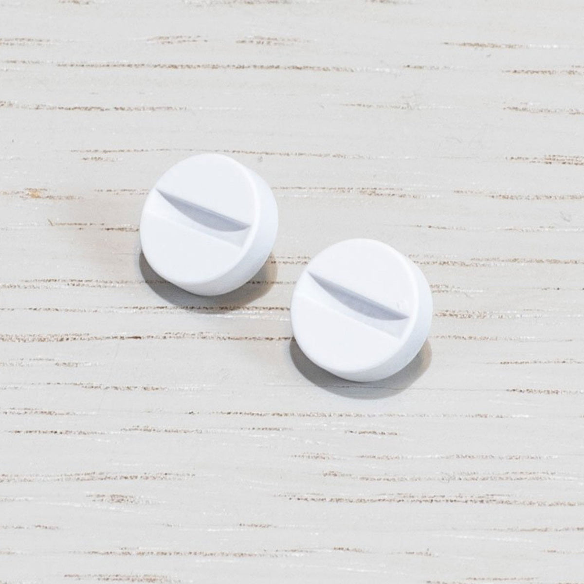 A Pair of Replacement Coin Caps For Switches in White