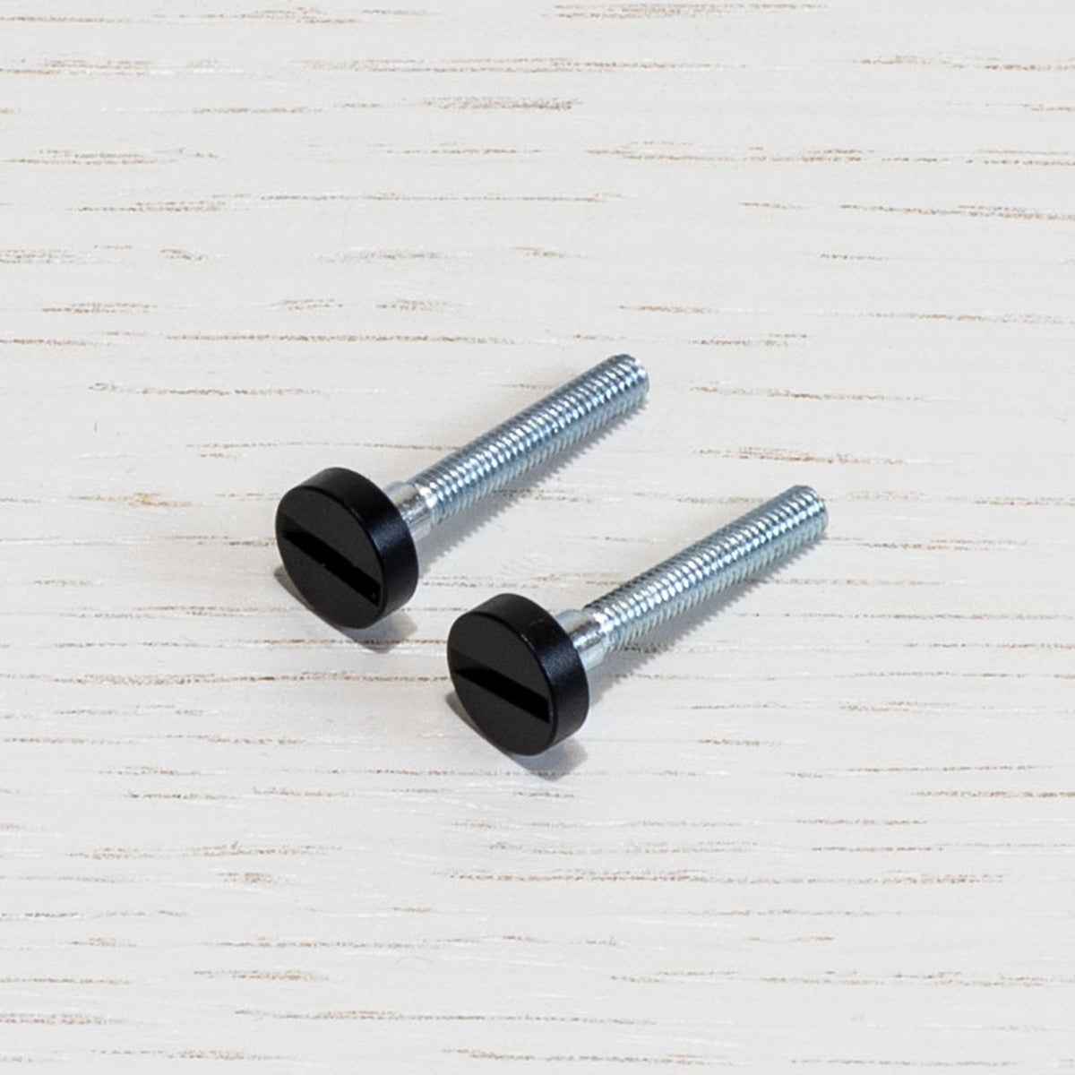 A Pair of Replacement Coin Caps with Screws For Switches in Black