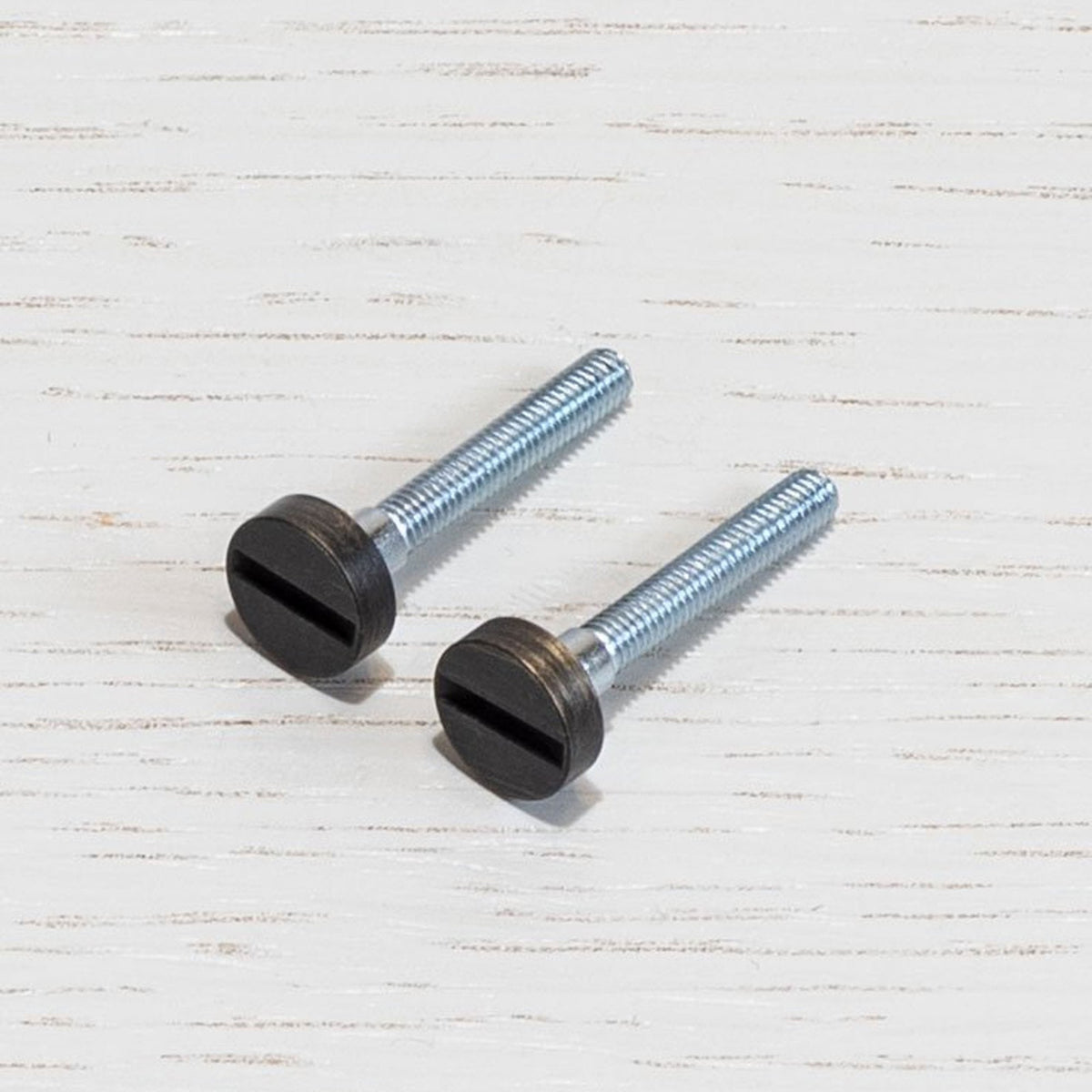 A Pair of Replacement Coin Caps with Screws For Switches in Smoked Bronze