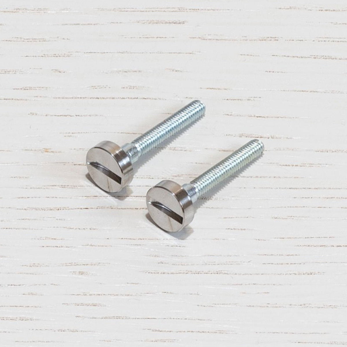 A Pair of Replacement Coin Caps with Screws For Switches in Steel