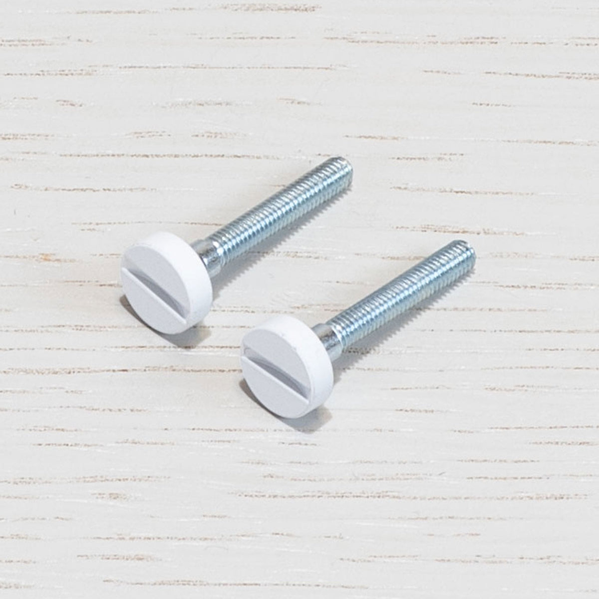 A Pair of Replacement Coin Caps with Screws For Switches in White