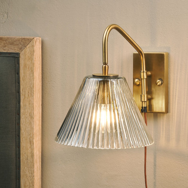 Akoli Plugged Wall Light in Antique Brass With Fluted Glass Shade