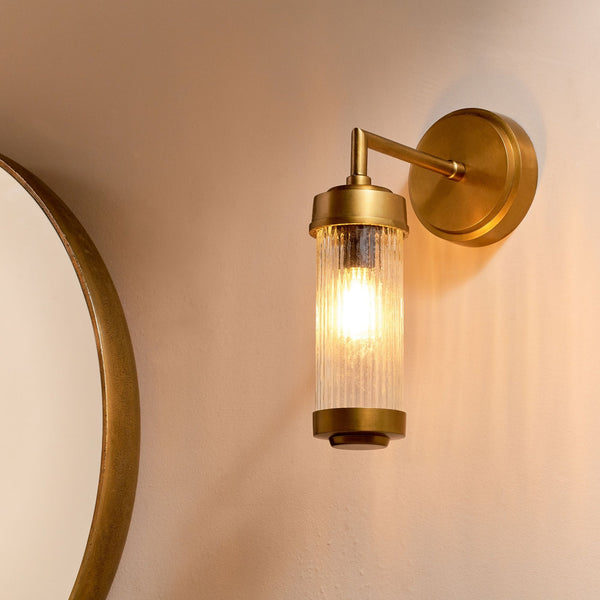 Akurdi IP44 Single Wall Light in Antique Brass With Ribbed Glass Shade