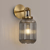 Atherington Wall Light in Brass Gold with Smoked Ribbed Glass Shade
