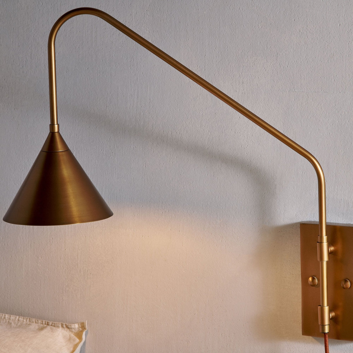 Thottam Plug In Swing Arm Wall Light in Antique Brass