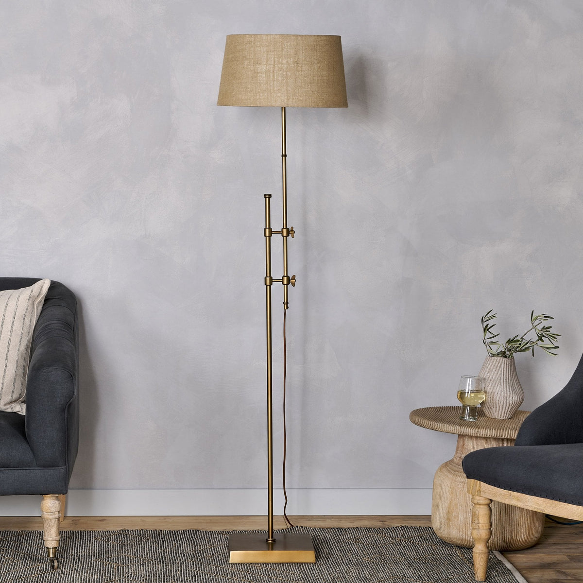 Chintala Adjustable Height Iron Floor Lamp In Antique Brass
