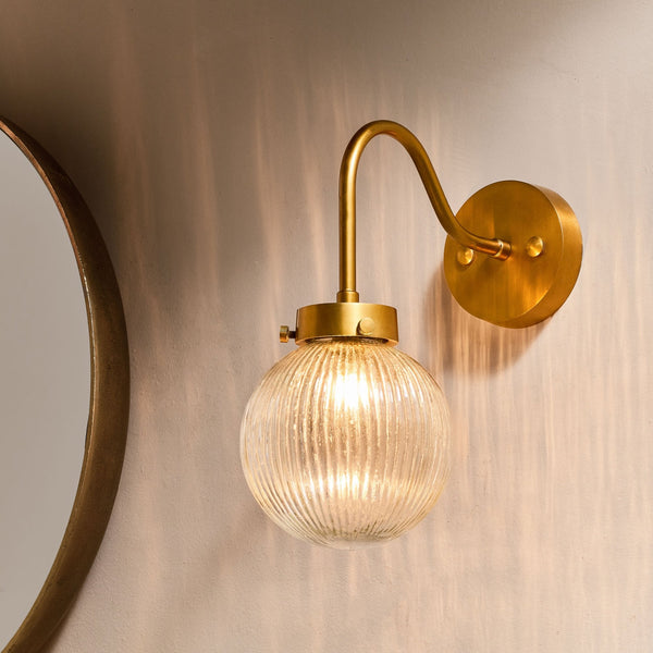 Konnie Clear Glass Bathroom Wall Light In Antique Brass