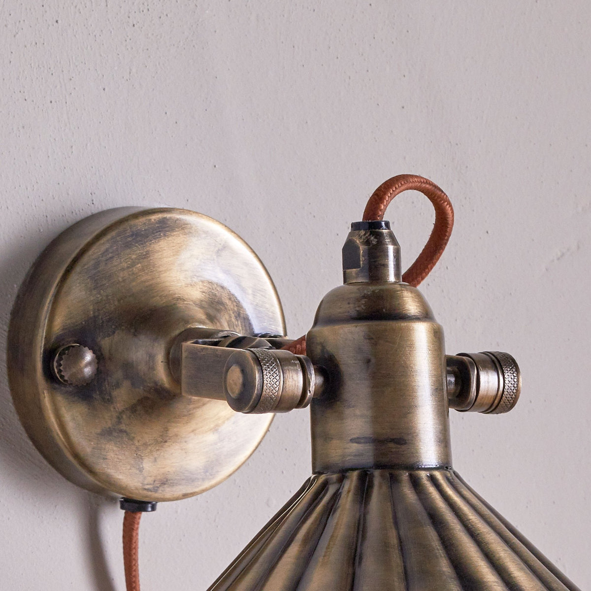 Moti Plugged Wall Light in Antique Brass With Fabric Cable
