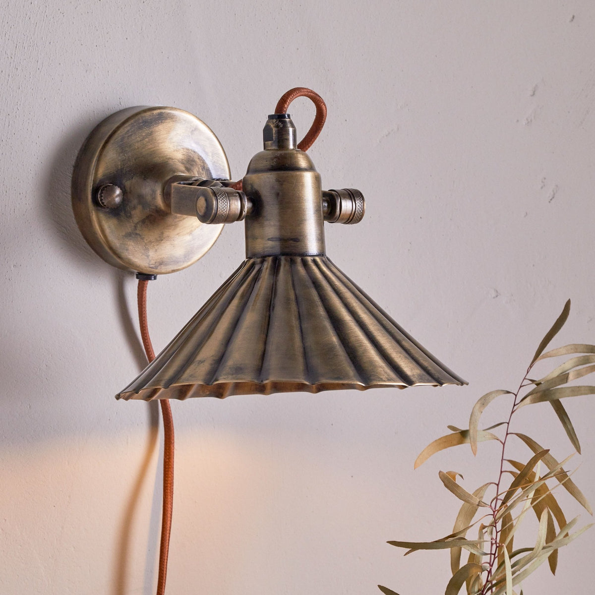 Moti Plugged Wall Light in Antique Brass With Fabric Cable