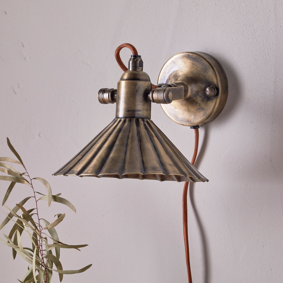 Moti Plugged Wall Light in Antique Brass With Fabric Cable