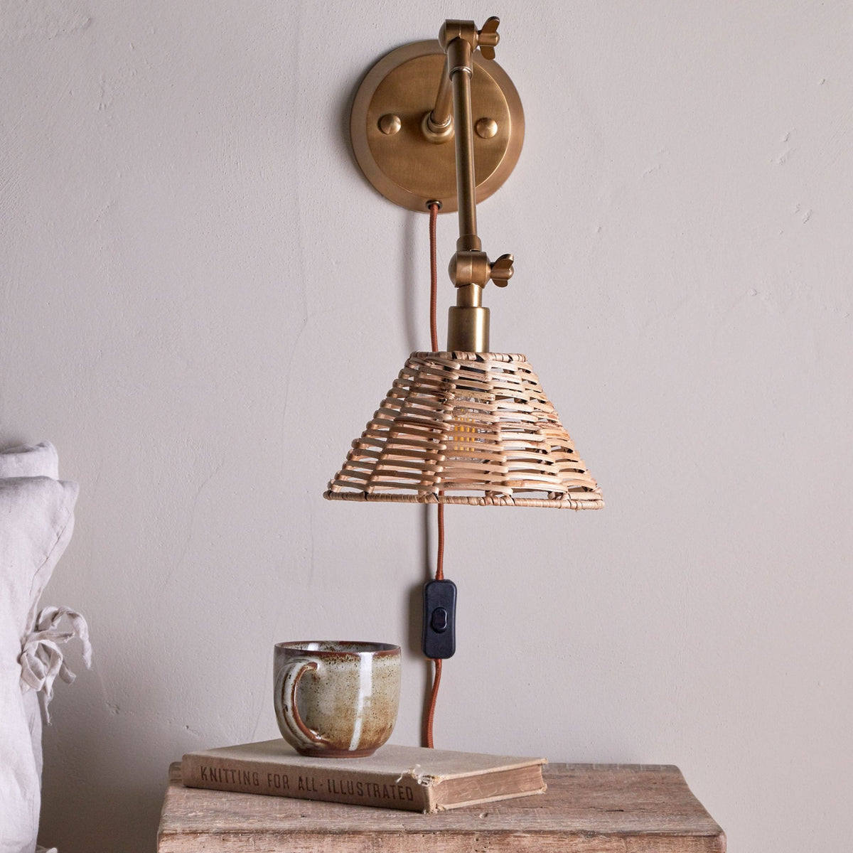 Noko Adjustable Plugged Wall Light in Antique Brass With Rattan Shade