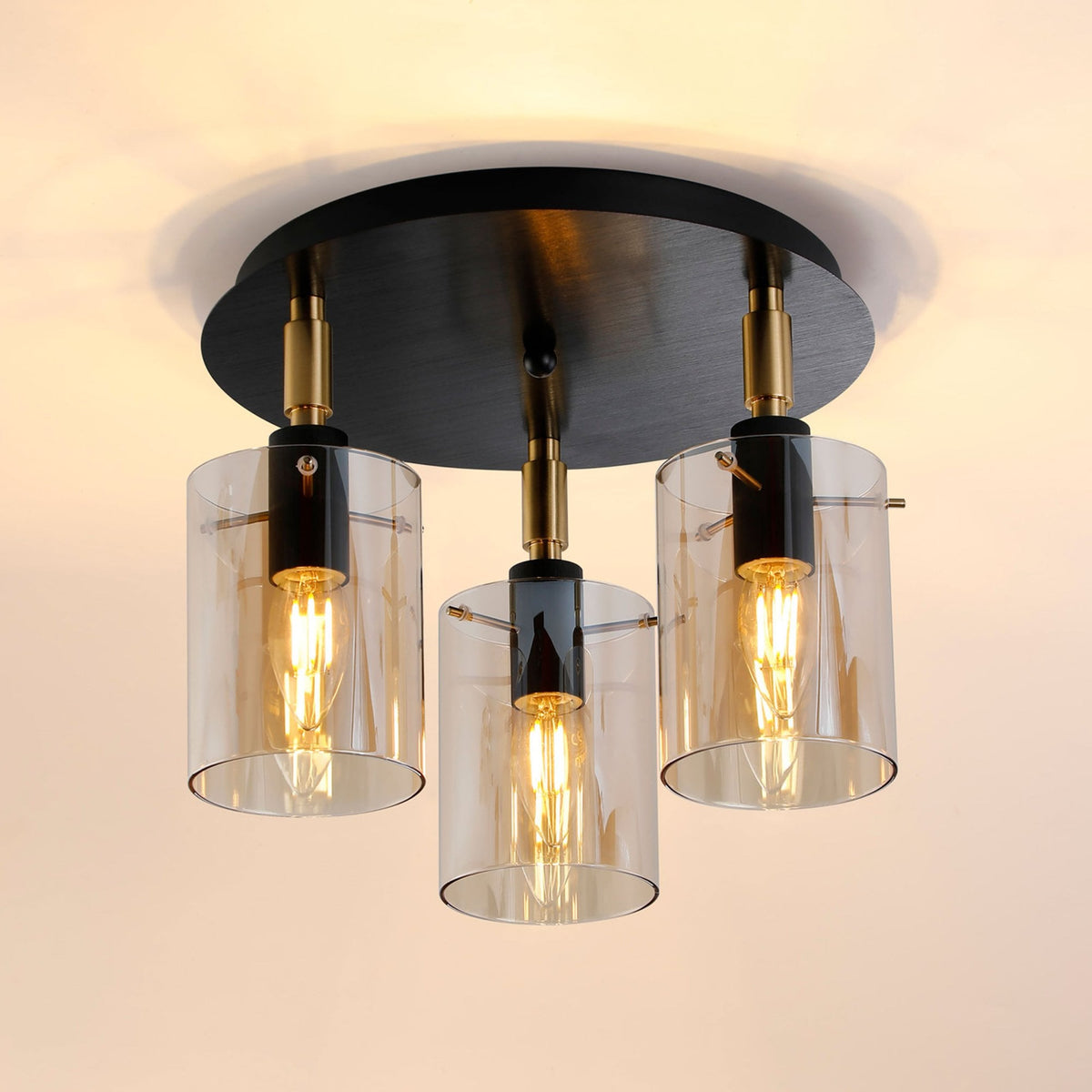 Kidwelly IP44 Triple Lamp Semi Flush Ceiling Light in Black & Brass Gold with Amber Glass Shades