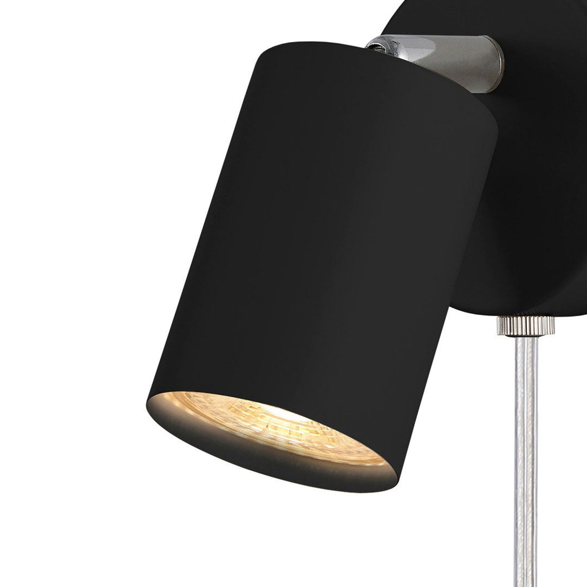 Close-up of the spotlight's head, showing the inner metallic surface and light.