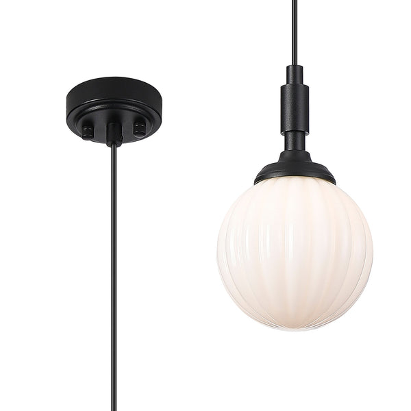 Close-up of the black ceiling rose and the fluted globe pendant light with a black fixture.