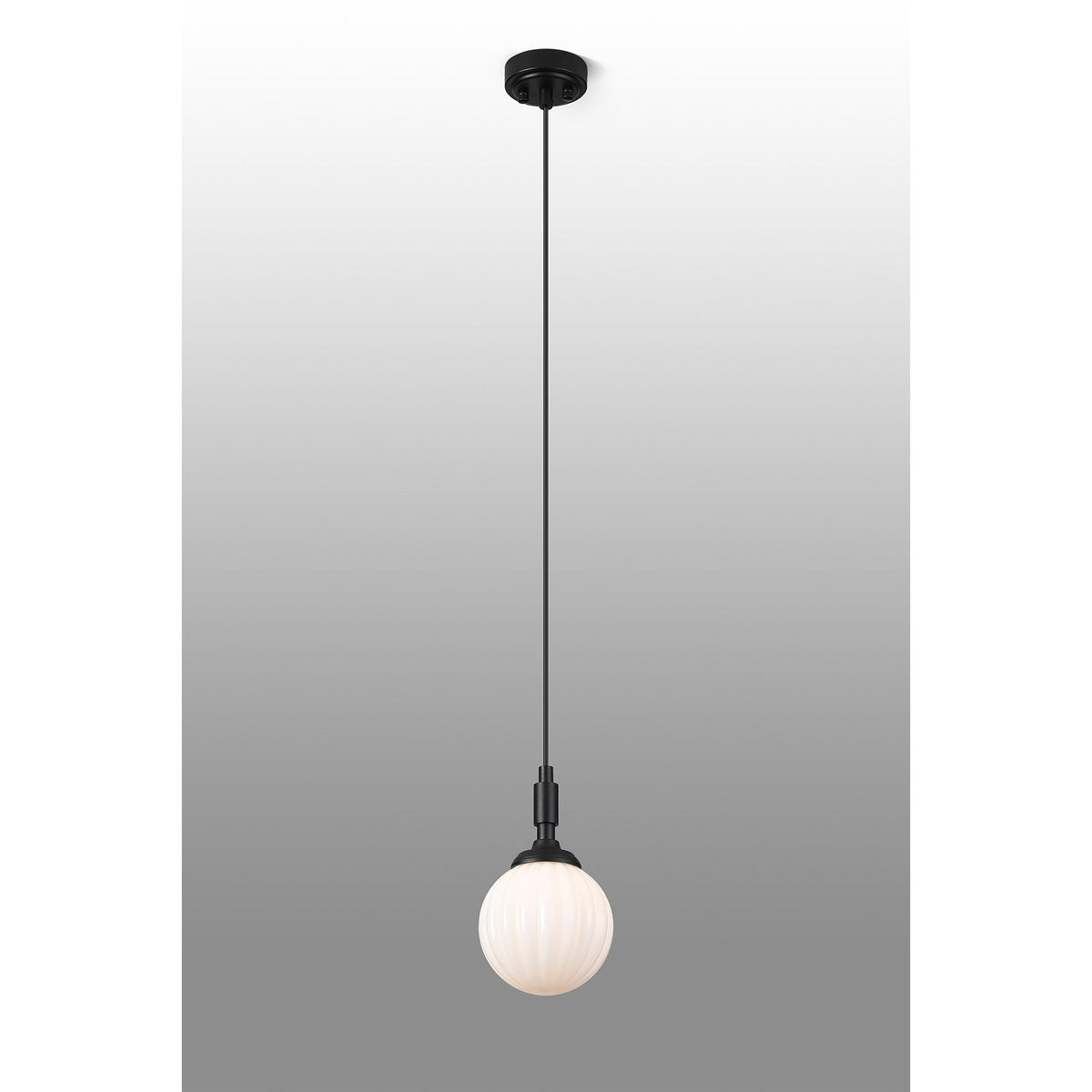 A full view of the black pendant light with a smooth white globe shade on a gradient background.