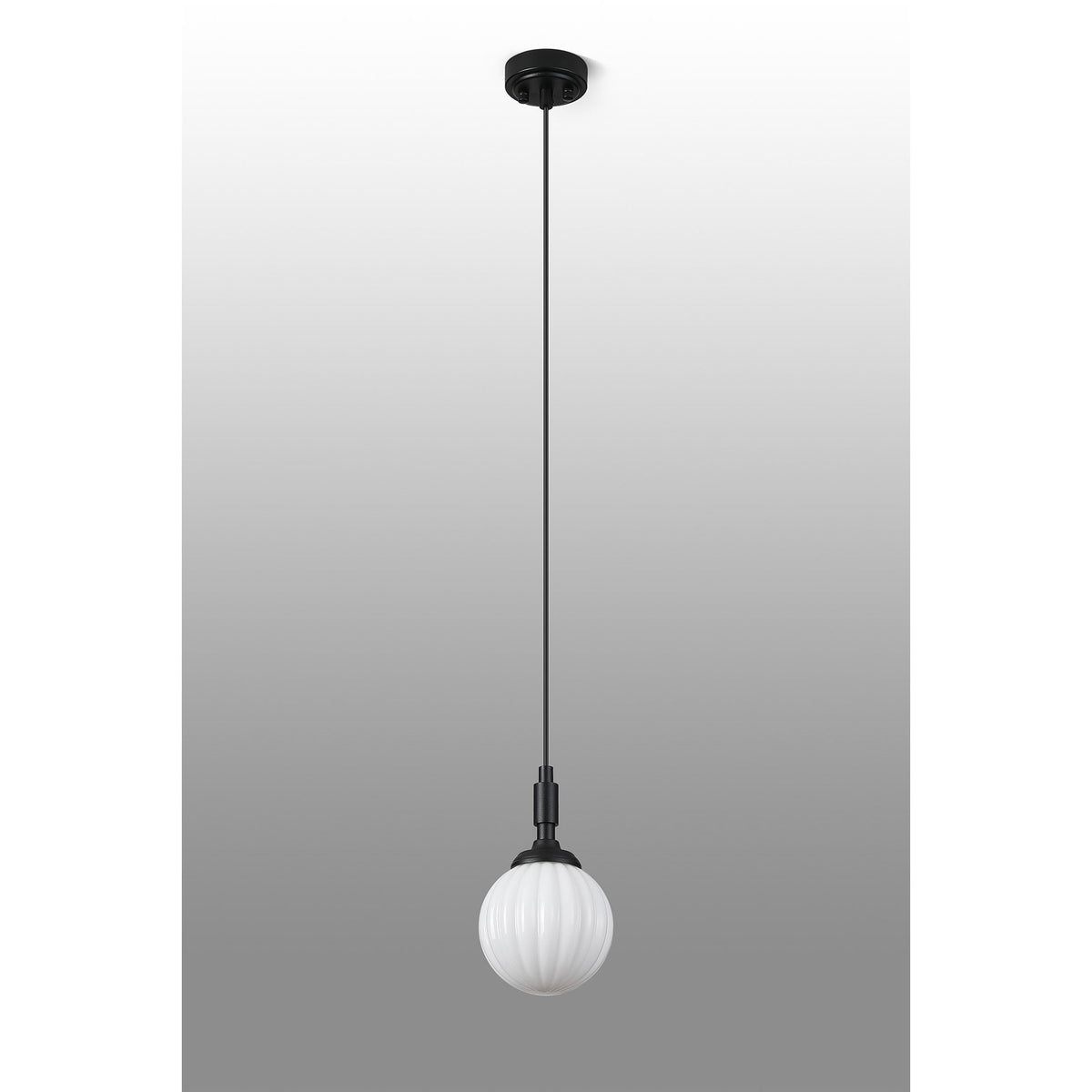 A full view of the black pendant light with a white fluted globe shade on a gradient background.