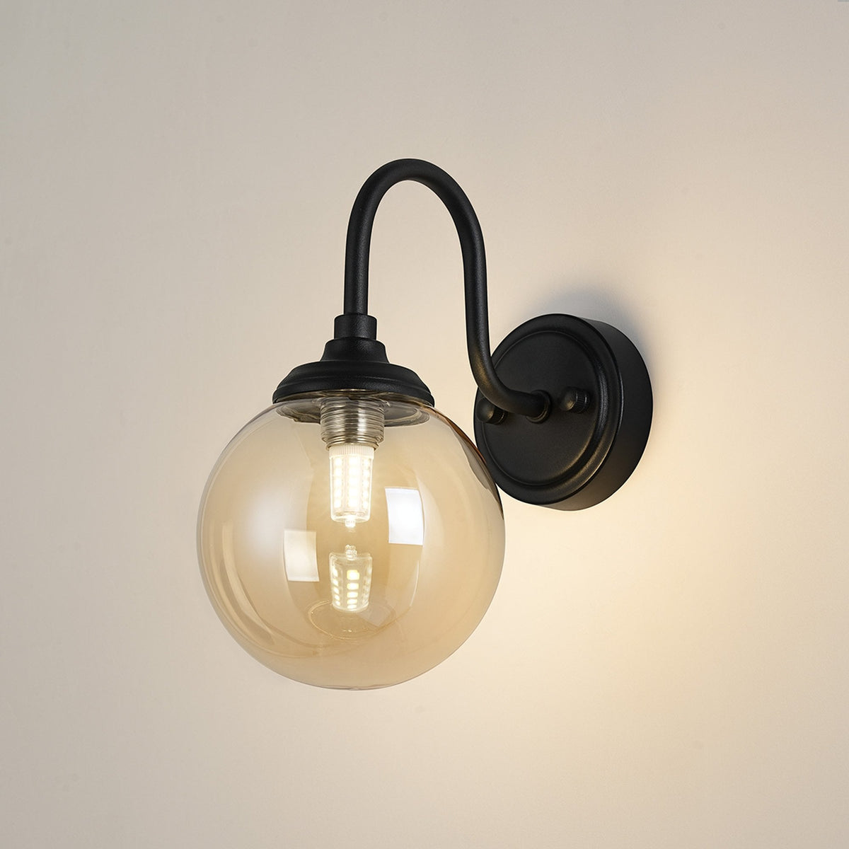 Loughton IP44 Curved Arm Wall Light in Satin Black with Smooth Round Glass Amber Diffuser