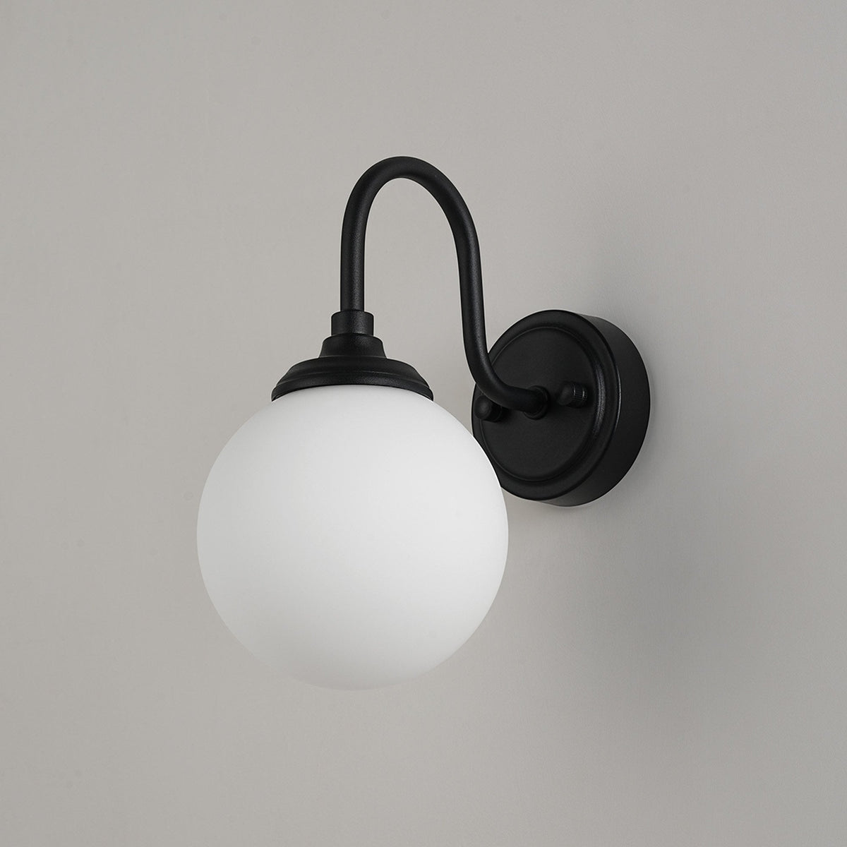 Loughton IP44 Curved Arm Wall Light in Satin Black with Smooth Round Glass Opal Diffuser