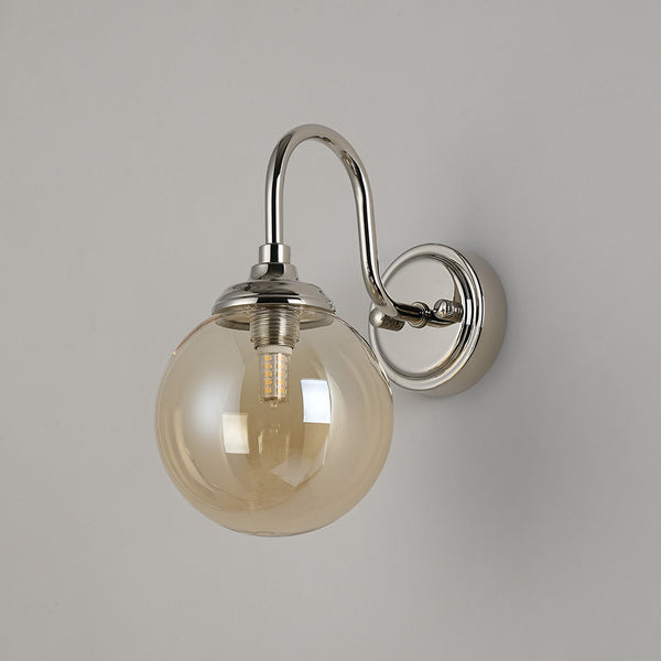 Loughton IP44 Curved Arm Wall Light in Polished Nickel with Smooth Round Glass Amber Diffuser
