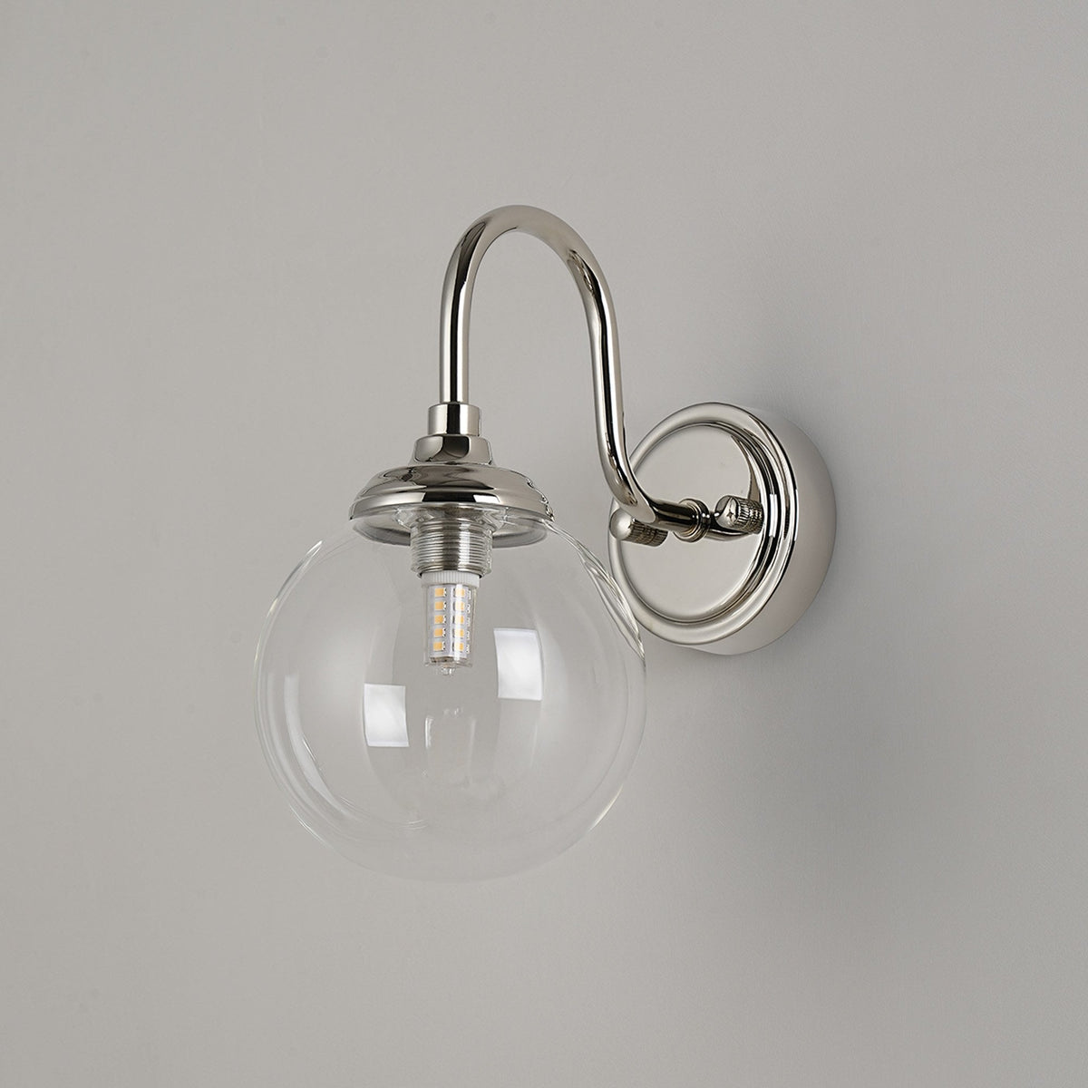 Loughton IP44 Curved Arm Wall Light in Polished Nickel with Smooth Round Glass Clear Diffuser