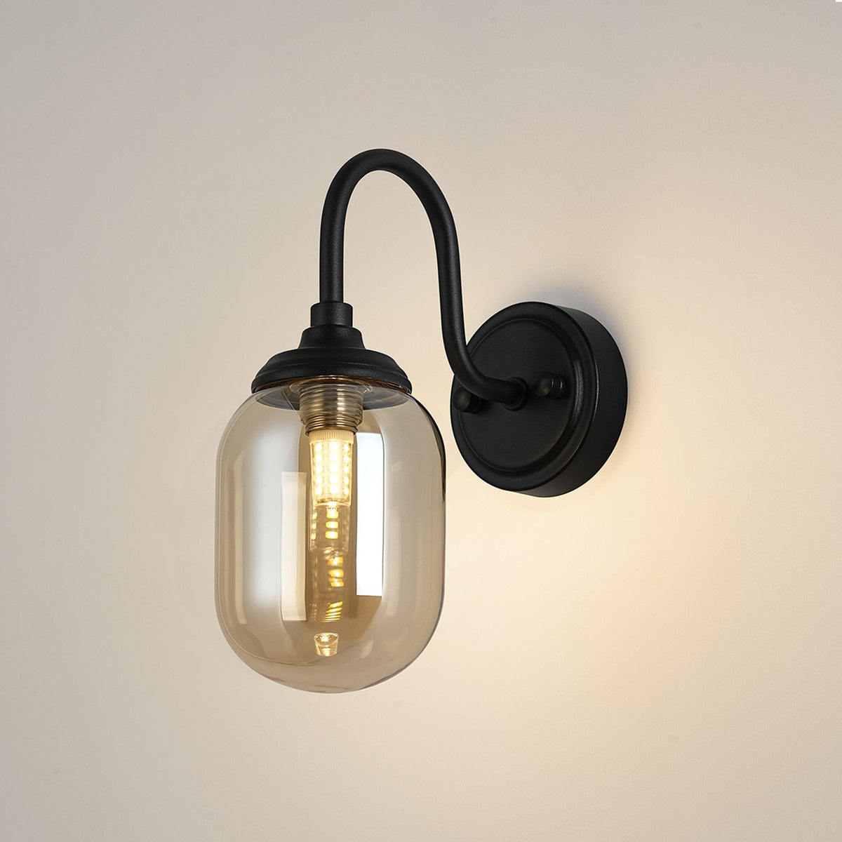 Loughton IP44 Curved Arm Wall Light in Satin Black with Smooth Tubular Glass Amber Diffuser