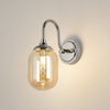 Loughton IP44 Curved Arm Wall Light in Polished Nickel with Smooth Tubular Glass Amber Diffuser