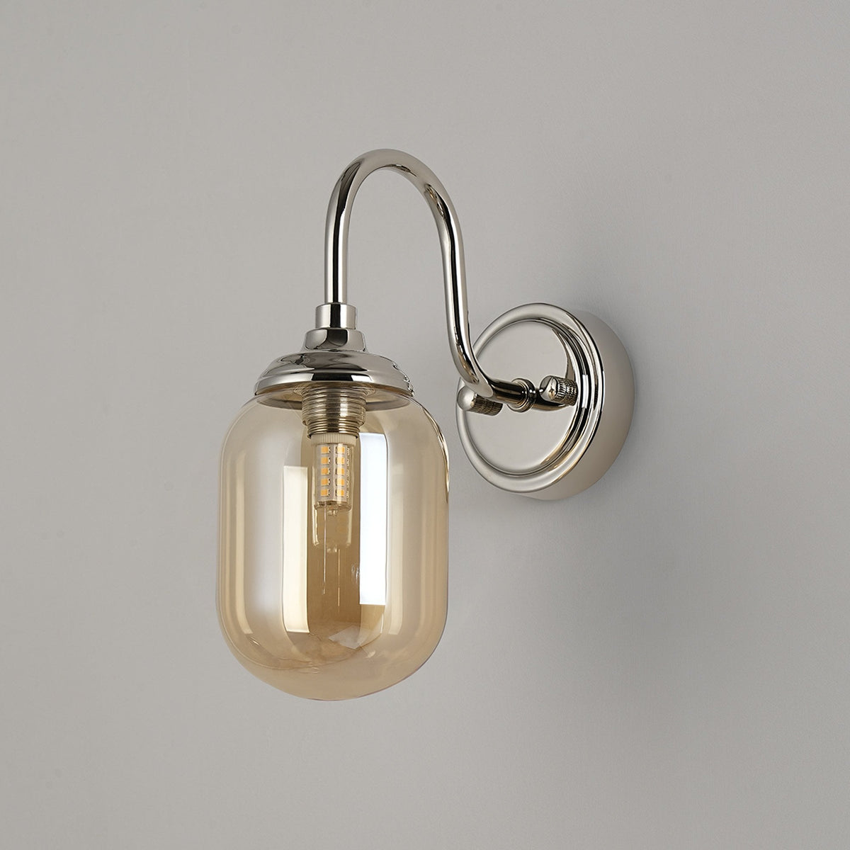 Loughton IP44 Curved Arm Wall Light in Polished Nickel with Smooth Tubular Glass Amber Diffuser