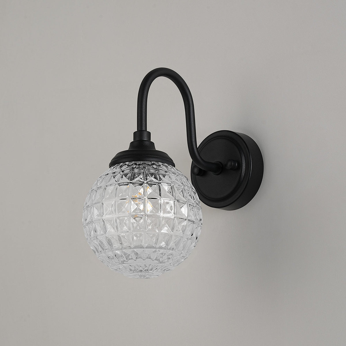 Loughton IP44 Curved Arm Wall Light in Satin Black with Cross Pattern Round Glass Clear Diffuser