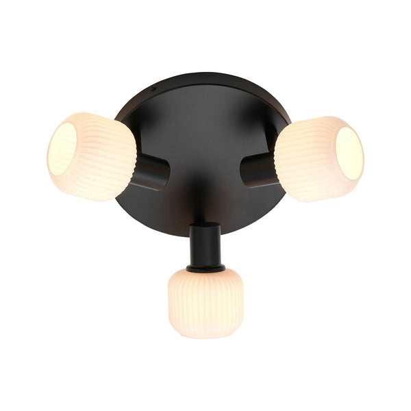 A round black ceiling light base supports three adjustable white fluted glass shades.