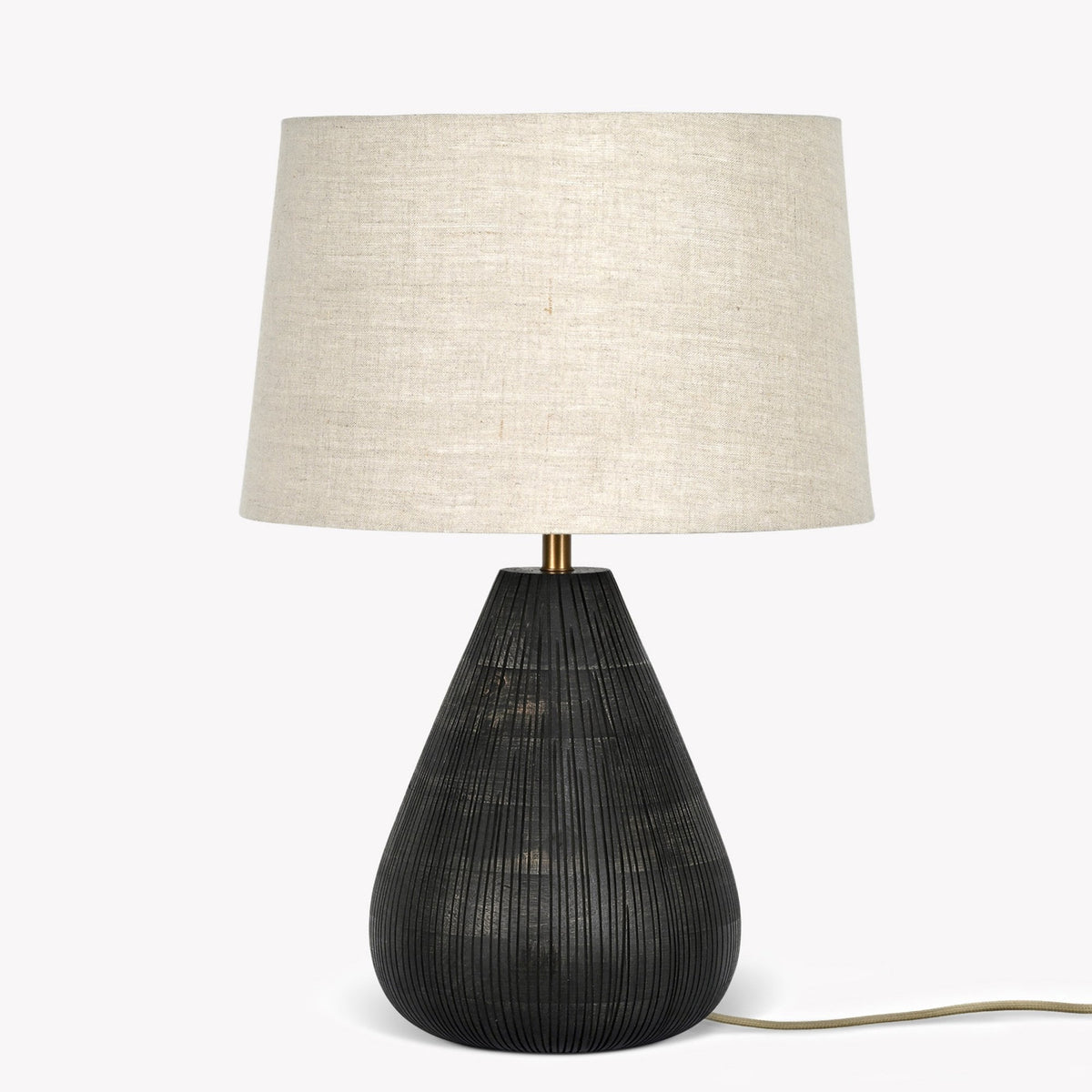 Black textured lamp with a light beige fabric shade, on a white background.