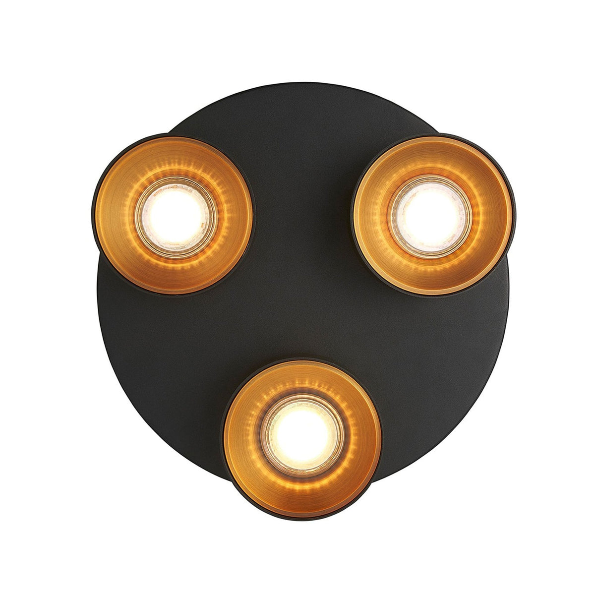 Overhead view of a black circular three-spot ceiling light with golden lamp interiors.