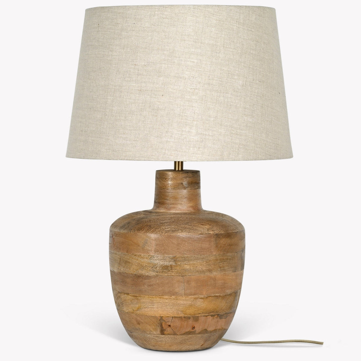 A wooden table lamp with a light-colored fabric shade, featuring a textured, natural wood base.