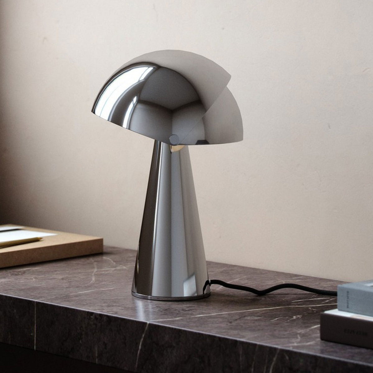 DFTP By Nordlux Align Table Lamp in Chrome with Adjustable Shade on a marble surface