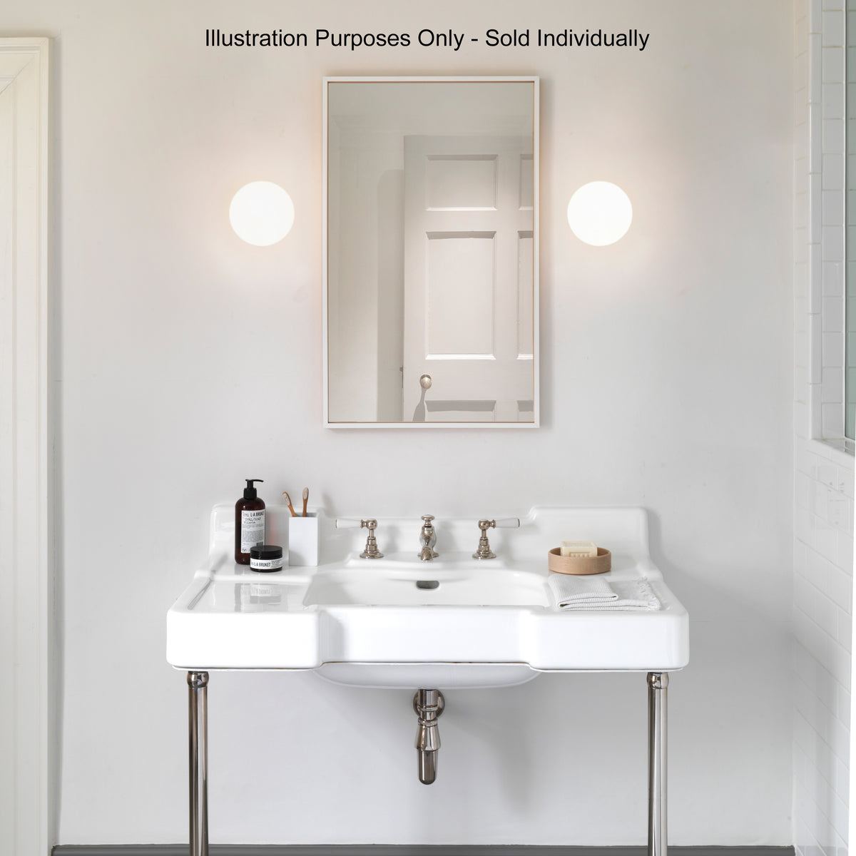 White bathroom vanity with a mirror, two wall sconces, and a white sink with chrome fixtures