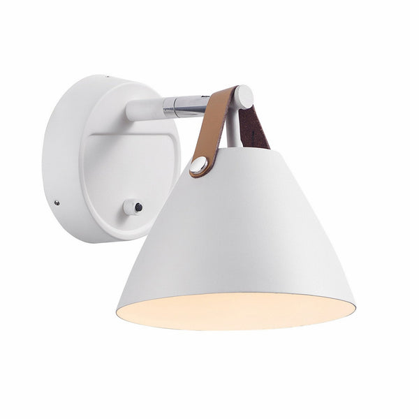 A close-up of a white metal tapered wall light with a brown leather strap, viewed from the left.