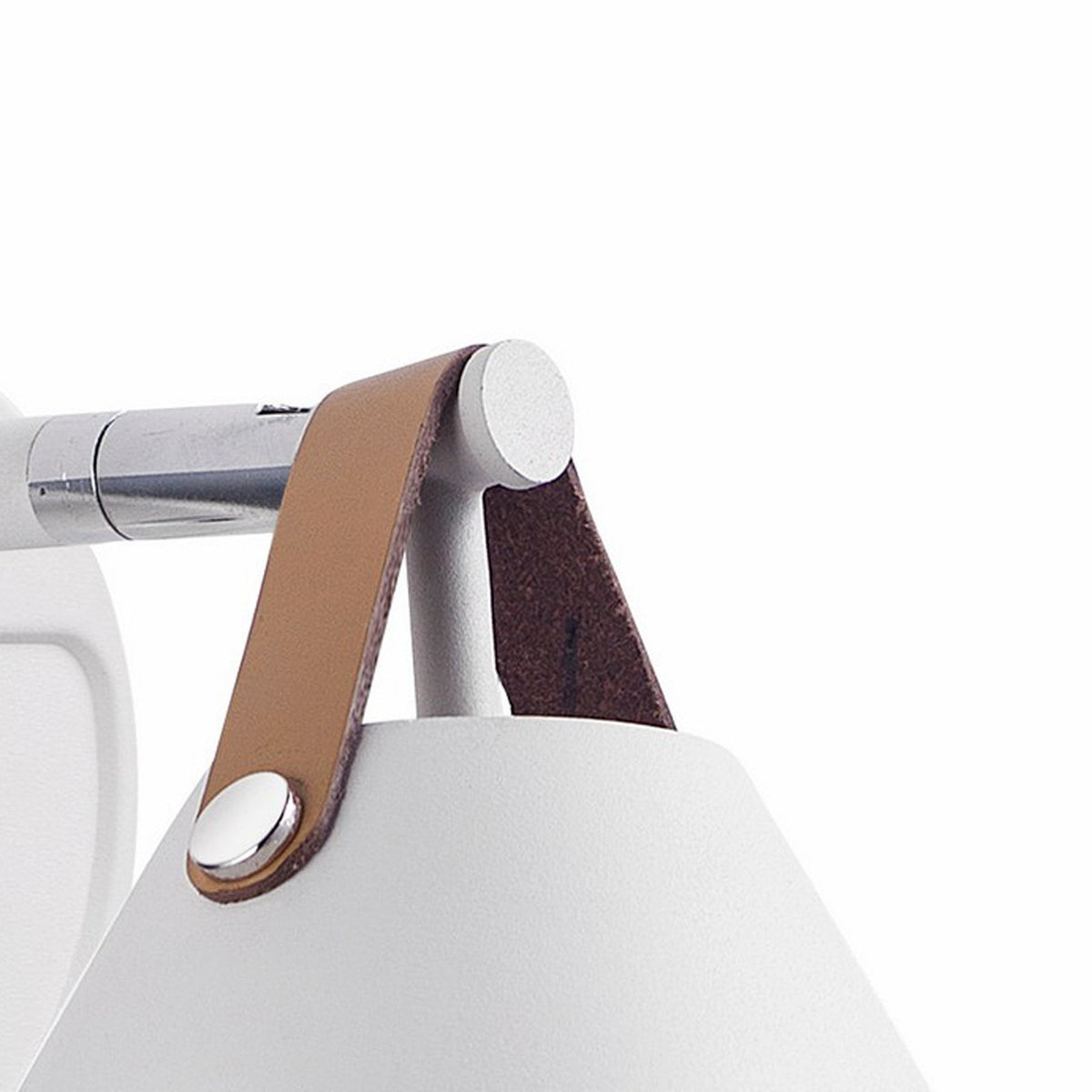 A close-up of the white tapered wall light, highlighting its brown leather strap detailing.
