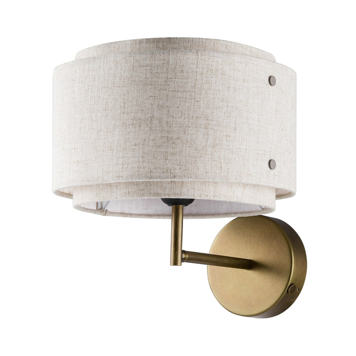 A close-up of a wall light with a textured fabric shade and a brass finish.