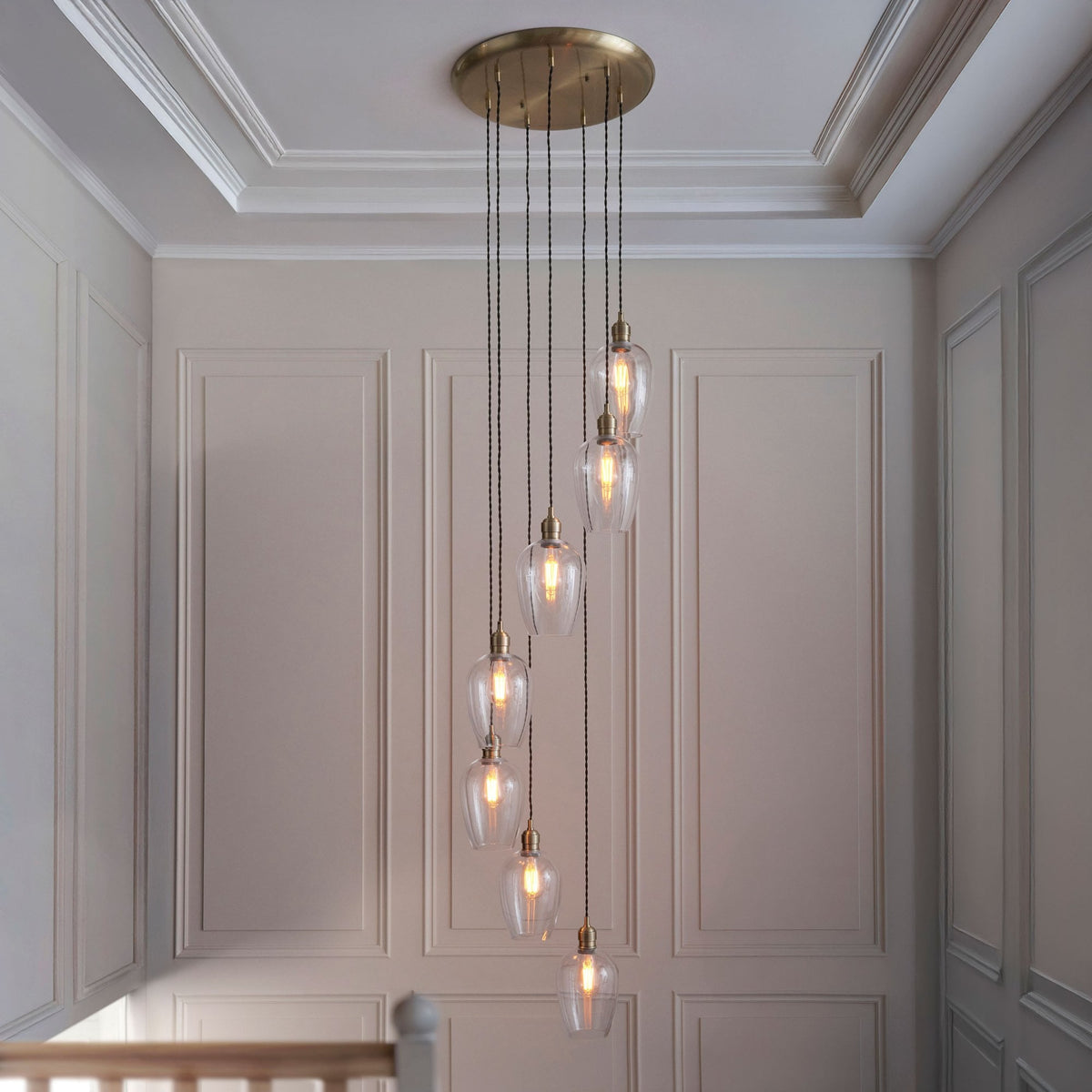 Hoburne 7 Light Cascade Pendant in Antique Brass with Clear Glass