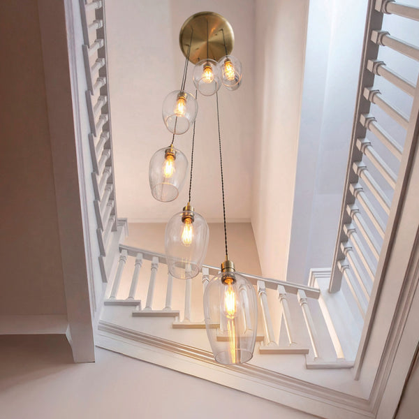 Hoburne 7 Light Cascade Pendant in Antique Brass with Clear Glass