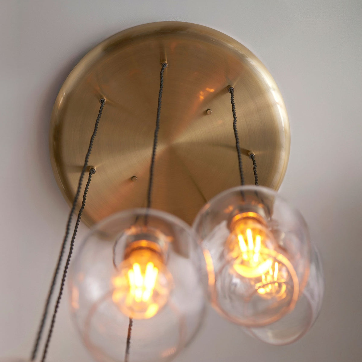 Hoburne 7 Light Cascade Pendant in Antique Brass with Clear Glass
