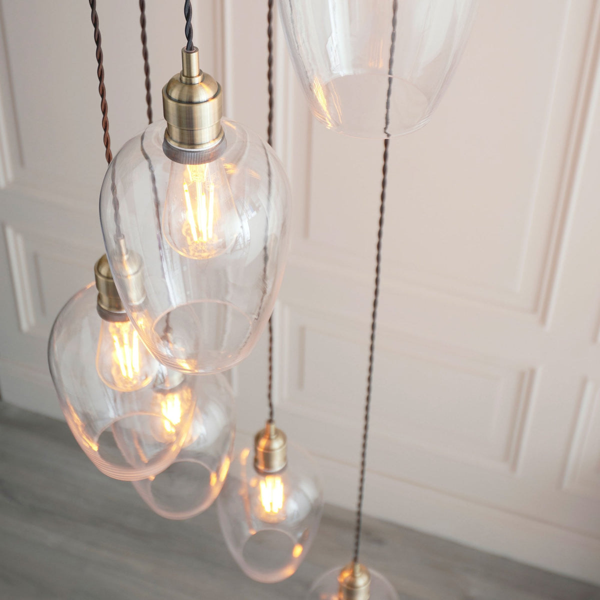 Hoburne 7 Light Cascade Pendant in Antique Brass with Clear Glass