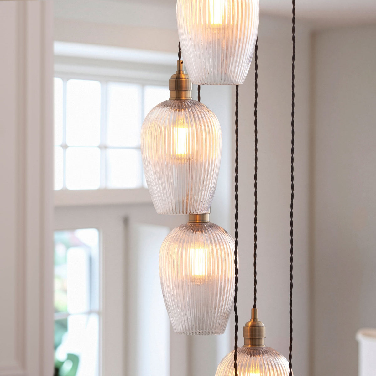 Hoburne 13 Light Cascade Pendant in Antique Brass with Clear Ribbed Glass