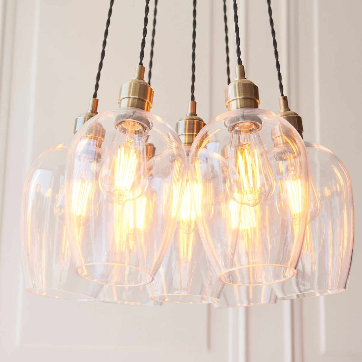 Hoburne 7 Light Cluster Pendant in Antique Brass with Clear Glass