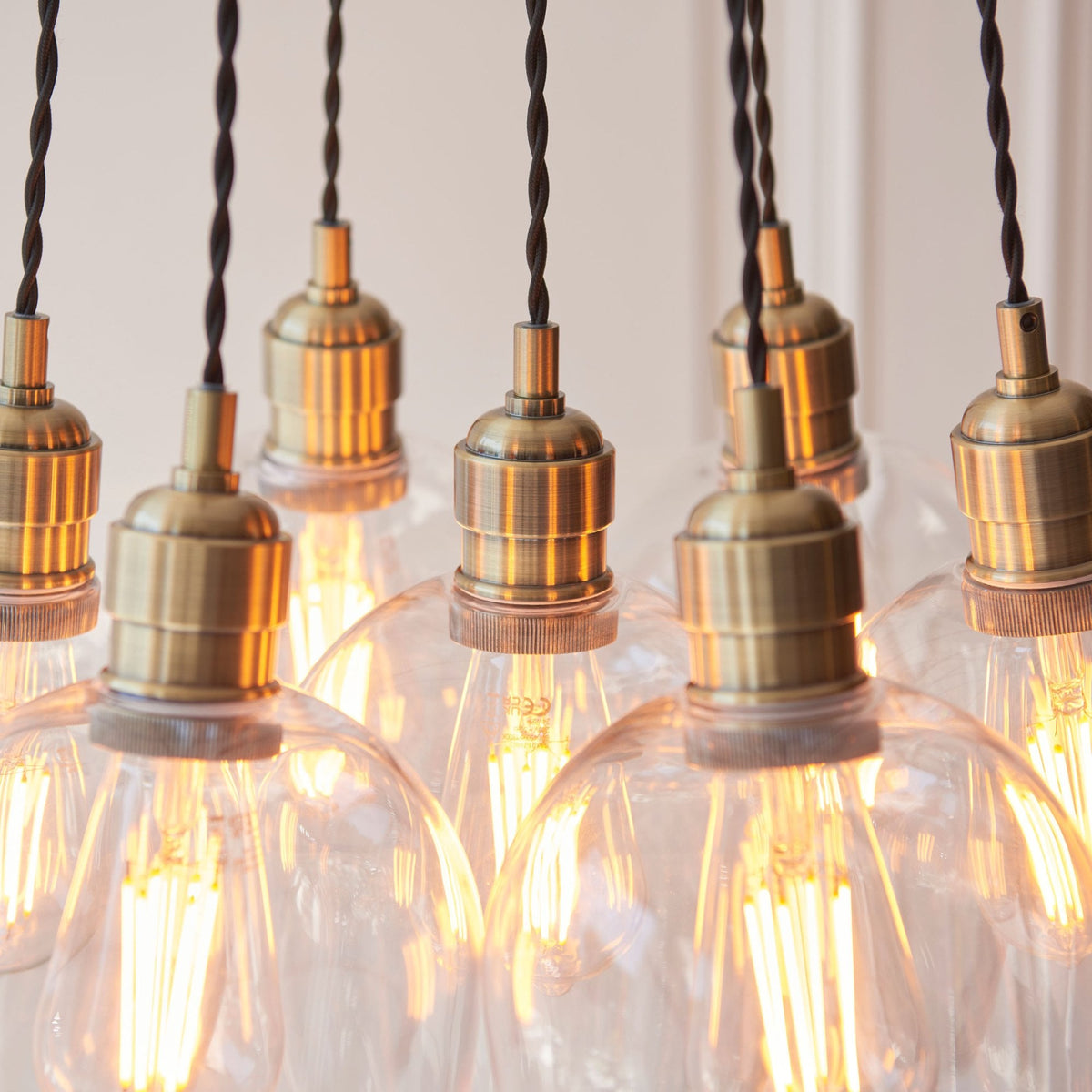 Hoburne 7 Light Cluster Pendant in Antique Brass with Clear Glass