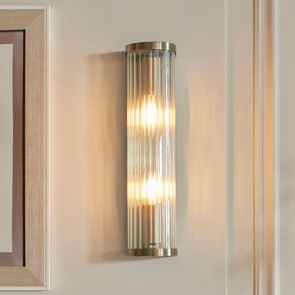 Ridgeton Twin Lamp Wall Light in Antique Brass & Clear Ribbed Glass