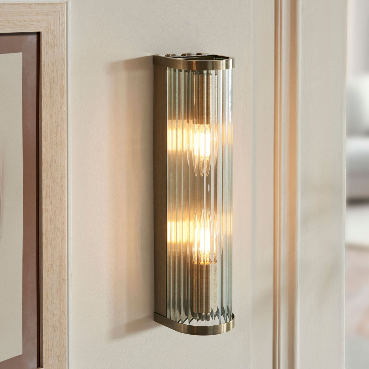 Ridgeton Twin Lamp Wall Light in Antique Brass & Clear Ribbed Glass